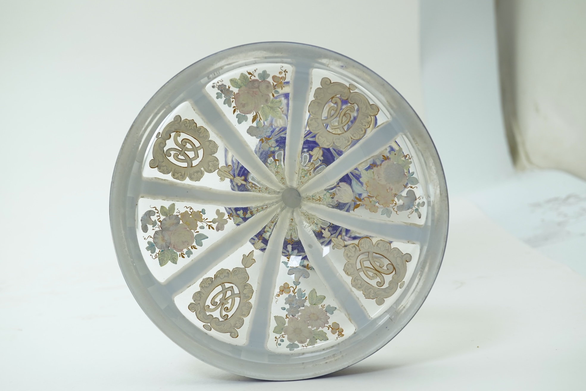 A tall 19th century Bohemian blue and white overlaid gilt and enamel decorated vase in the manner of Moser